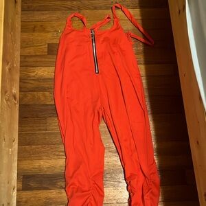 Red woman’s jumpsuit.The material is stretchy and machine washable.